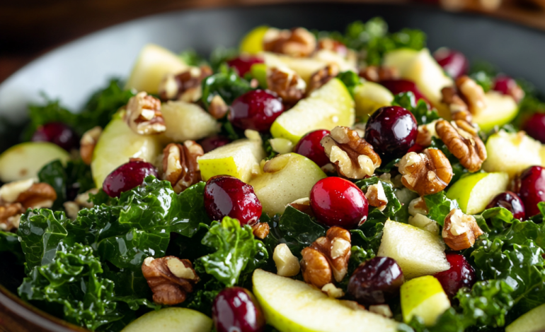 Close-up photo of a vibrant Autumn Apple Cranberry Kale Salad, featuring fresh kale, sliced apples, cranberries, and walnuts in a wooden bowl. The salad is drizzled with a light vinaigrette, set against a cozy fall backdrop with soft lighting.